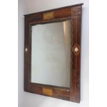 A  mahogany framed rectangular wall mirror with chequer board and mother of pearl inlay, 50cm by