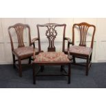 A George III elbow chair and a pair of dining chairs