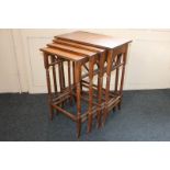 A nest of four oak Arts and Crafts side tables with slender turned legs, 60cm