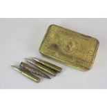 A First World War brass Christmas tin, three bullet cartridges inscribed Ypres, and another with