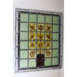 Nine leaded stained glass windows, all showing flowers in an urn with green surround, 48cm by 60cm