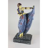 An Art Deco style resin figure of a lady dancing, on marble effect base, 41cm high