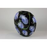 A 1950's large ovoid glass vase decorated with blue and green on a black ground with gold flecks,