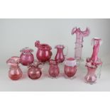 Ten Victorian and later cranberry glass vases and jugs