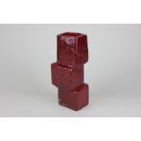 A Whitefriars style drunken bricklayer vase in red, 21cm high