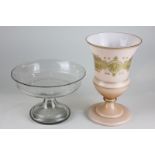 A soft pink Victorian baluster shaped glass vase with gilt decoration depicting a harp surrounded by