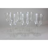 A set of six clear glass goblets