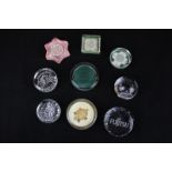 Nine glass paperweights including two commemorating Elizabeth II, an Edinburgh crystal