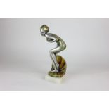 An Art Deco style resin figure of a female swimmer in metallic finish on stone base, 27cm high