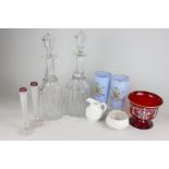 A pair of cut glass decanters, a pair of glass bud vases, a pair of commemorative glasses, two