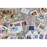 A large collection of loose British Commonwealth and world stamps