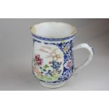 A Chinese porcelain mug depicting a scene of a garden with blue and floral surround (a/f - heavily