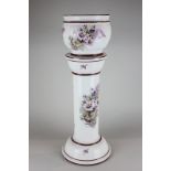 A Capodimonte jardiniere and stand decorated with floral motifs, 60cm total height