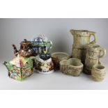 Five pieces of Hillstonia pottery, two jugs and three bowls, together with four teapots, two