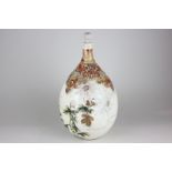 A Japanese Satsuma pottery bottle with stopper, ovoid shape, decorated with chrysanthemums, with