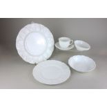 A Wedgwood porcelain countryware cabbage leaf pattern part dinner and tea service in plain white