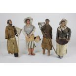 Four various 19th century terracotta head figure dolls, possibly creche figures, of two fishermen,