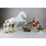 A Portuguese porcelain model of a horse in white, three ceramic pub beer pump handles, all decorated