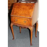 A small walnut bureau with single drawer, on cabriole legs, 57cm