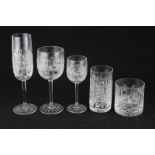 A set of six Bohemian cut glass champagne flutes, whiskey tumblers, red wine, white wine and tall