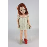 A Suzanne Effanbee doll made in USA, with bracelet embossed Durable Dolls, with sleeping eyes and