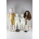 Eight various dolls included bisque head doll on leather body, with bisque hands and feet, stamped