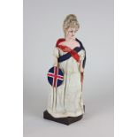 A late Victorian wax over composition fashion doll representing Britannia, in cotton dress with blue