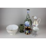 An English pottery bottle neck pottery case, two bud vases, a lustre ware cup and a gilt decorated