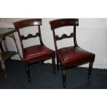 A pair of 19th century mahogany dining chairs with curved backs, carved supports and red 'leather'