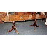 A regency style mahogany D-end extending dining table with one extra leaf, together with a set of