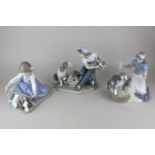 Three Lladro porcelain figures of children with dogs, including This one's mine (5376), Dog's best