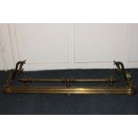 A brass fire fender with reeded gallery and tapered finials, 133cm