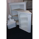 A white painted corner cupboard with detached unpainted door, 74cm, and two smaller painted corner