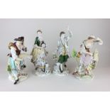 Two pairs of Sitzendorf porcelain figures of a man and woman shearing sheep and a gentleman