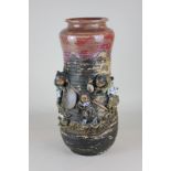 A 19th century Japanese pottery vase (circa 1880) with overlaid decoration of children playing