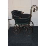 An early 20th century doll's pram, 66cm to handle