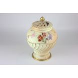A Royal Worcester porcelain pot pourri jar and cover in blush ivory, hand painted with floral sprays