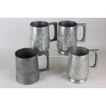 Four pewter tankards, each with dragon detail