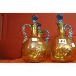 19th cent. French glass: Portieux brown decanters, blue rope handles and stoppers. (4).