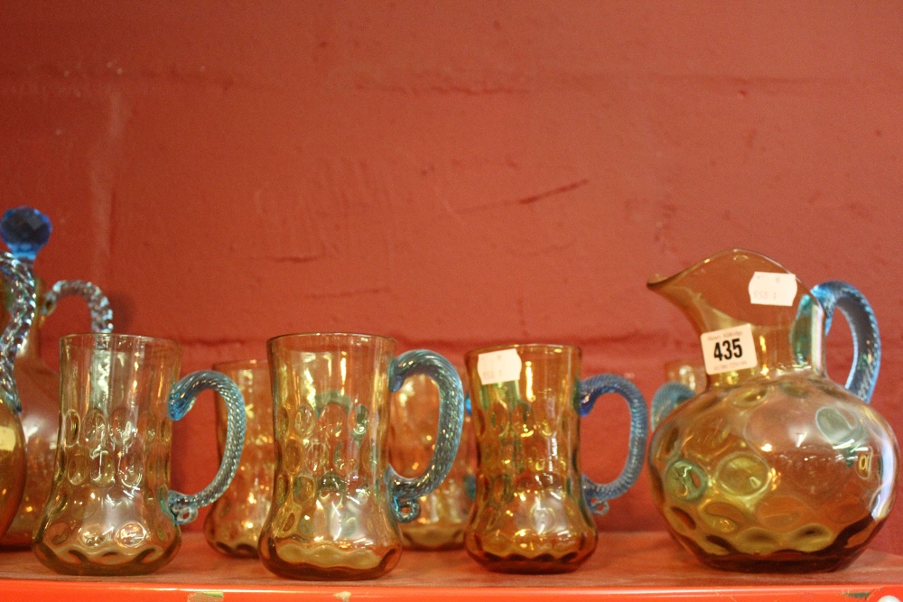 19th cent. French glass: Portieux amber glass jug, blue twist handle and 6 matching blue handle