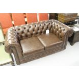 20th cent. Two seater brown leather chesterfield.