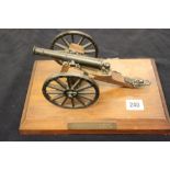 Hallmarked silver: Military presentation brass cannon on a treen carriage & mounted on a plaque