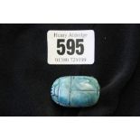 Objects of virtu: Faience Egyptian scarab.