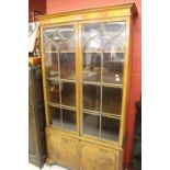 Early 20th cent. Mahogany display cupboard, glazed doors with moulding decoration above 2 solid twin