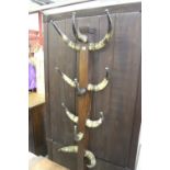 Eclectic Furniture: 19th cent. Oak hat stand with pewter tipped cow horn hangers.