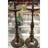 17th cent. Walnut pricket candlesticks, drip pan with turned columns & circular foot rim - a pair.