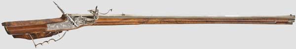 A German wheellock rifle with key, circa 1680   Slightly swamped, octagonal barrel with eight-groove