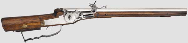 A light wheellock carbine, Gummi in Kulmbach, dated 1649   The pentagonal "hog back" barrel with