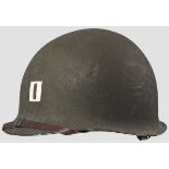 A steel helmet M 1, US Army captain   90 % rough olive drab green paint, 95 % white painted
