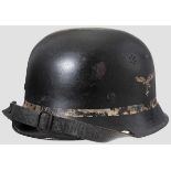 A lightweight steel helmet M 34, Luftwaffe, fire brigade, DD 80 % black paint, 70 % white painted